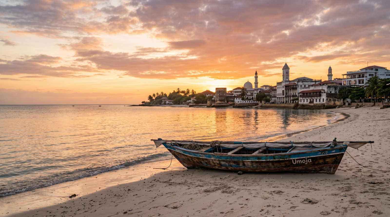 A traditional Zanzibari dhow boat on the beach at golden hour with ocean and architecture in the background
